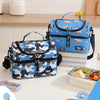 A blue and white insulated double-layer lunch bag with cartoon prints resting on a white table.