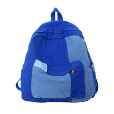 Mochila de moda de lona azul real con un panel de acento gris.