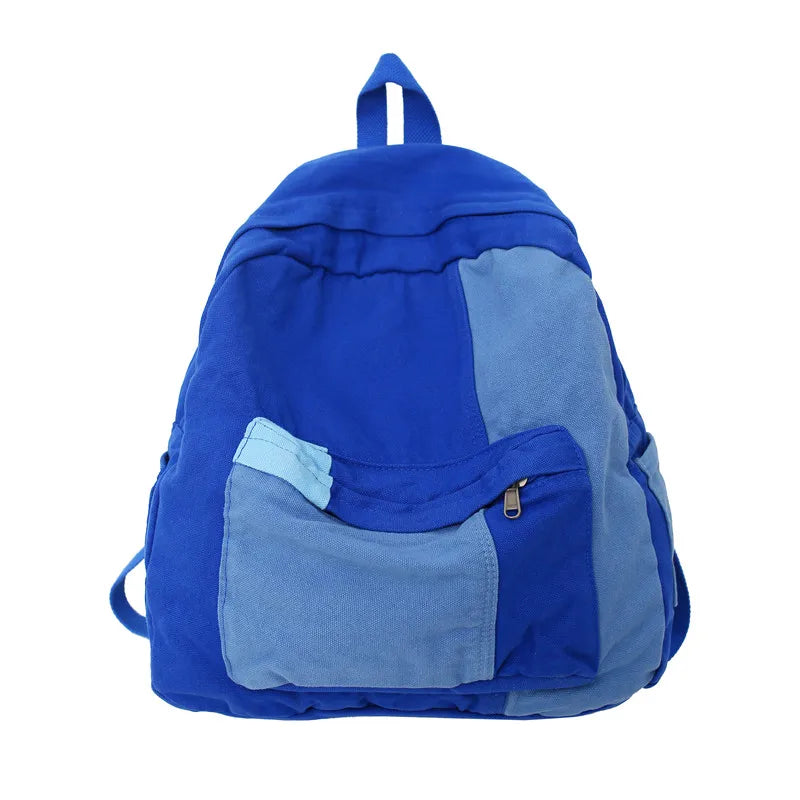 A royal blue canvas fashion backpack with a gray accent panel.