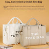Un sac cabas de luxe en PU couleur crème est exposé sur un fond clair.