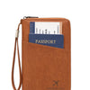 A brown leather passport holder with a lanyard, featuring an RFID blocking design and the Charm Infinite brand.