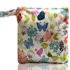 A patterned reusable waterproof snack bag featuring floral and butterfly designs on a white background.