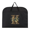 Black fabric dust cover and storage bag with a gold initial K embroidered on it.