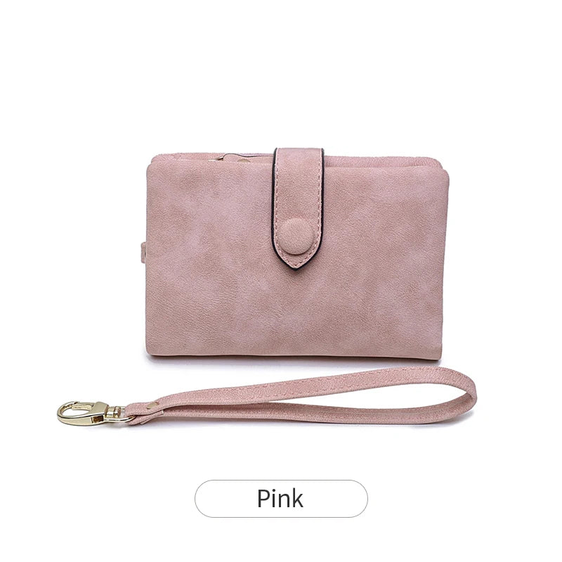 A pink women's multi-slot frosted card wallet with a leather strap.