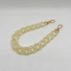 A light yellow acrylic chain bracelet with a gold-colored clasp.