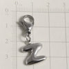 Silver stainless steel alphabet letter charm shaped like the letter Z with a lobster clasp