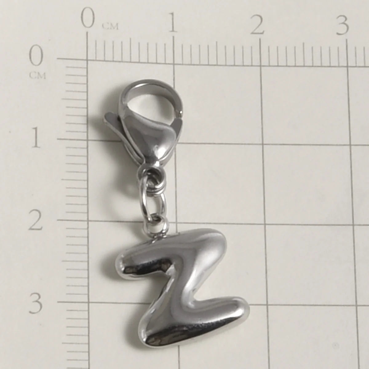Silver stainless steel alphabet letter charm shaped like the letter Z with a lobster clasp