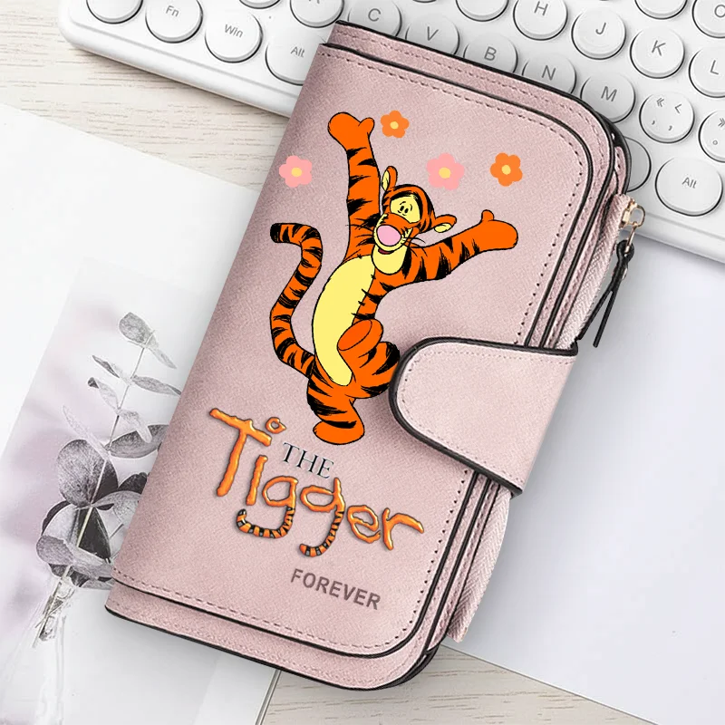 A pink women's long zipper handbag featuring an orange tiger graphic and the text Forever