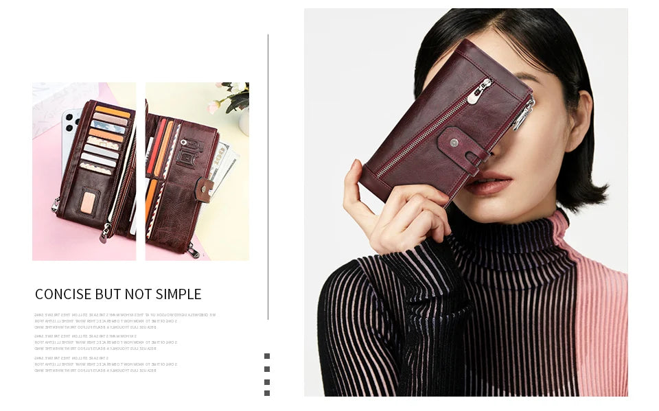 A woman holds a dark brown genuine leather vintage clutch wallet in a diagonal angle against a striped top.