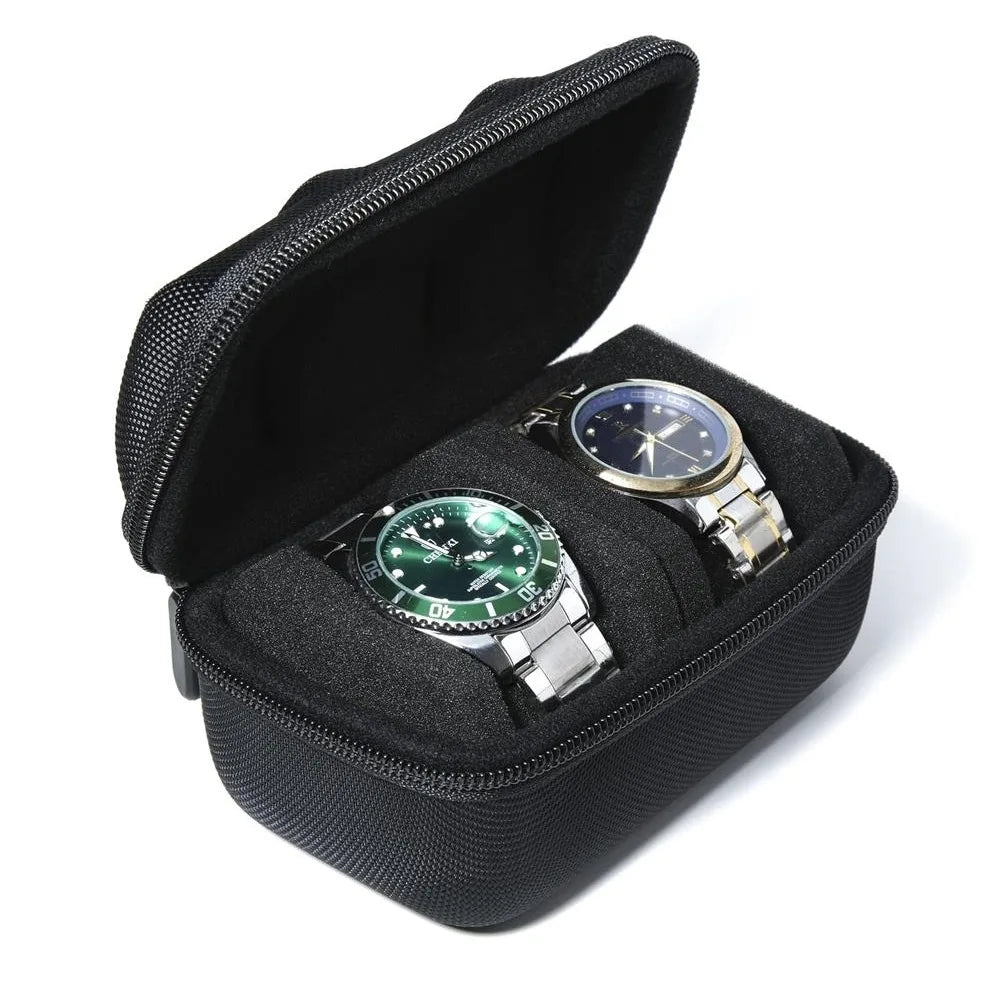A black leather watch organizer travel case with a zippered lid holding a silver-toned wristwatch.