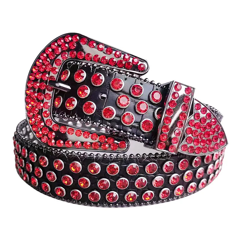 A silver-toned decorative Western buckle belt featuring red rhinestones and black metal.