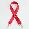 A bright red adjustable nylon shoulder strap with metal clasps.