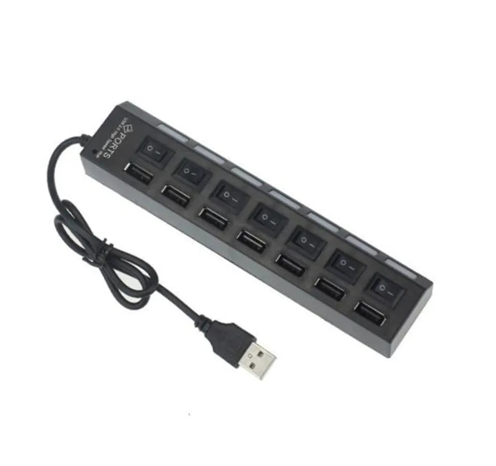 A black 7-port USB splitter hub with individual on/off switches and a cable.