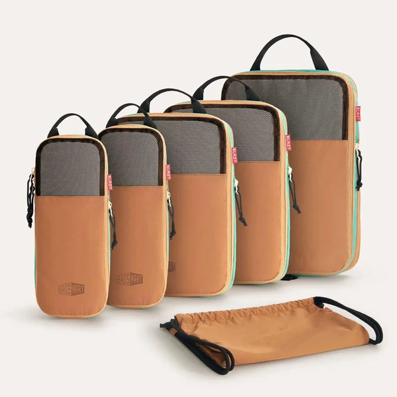 A set of six tan and gray expandable compression packing cubes are displayed on a white background.
