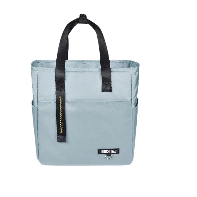 Light blue insulated lunch bag with black straps and zipper closure