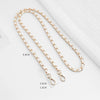 Gold-toned chain strap with a buckle shown against a white background.