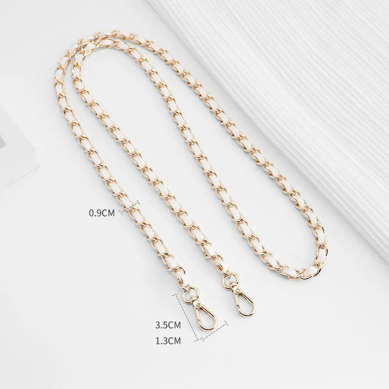 Gold-toned chain strap with a buckle shown against a white background.