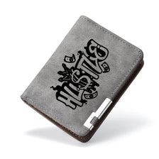 A dark gray PU leather wallet with a black cartoon print on the cover.