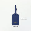 A dark blue PU leather luggage tag with the name Lisa engraved on it, featuring a silver clip.