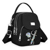 Sac bandoulière floral noir et durable avec fermeture éclair et quincaillerie argentée.