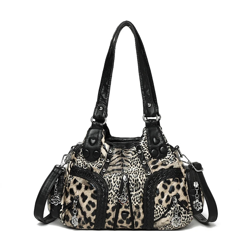 A black PU leather tote bag with an adjustable strap featuring a leopard print design.