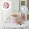 Pink instant-open flat lay makeup organizer bag with a drawstring closure displayed on a white table.