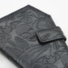 Black leather wallet embossed with a gothic skull and vintage design details.