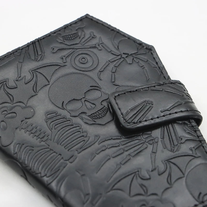 Black leather wallet embossed with a gothic skull and vintage design details.
