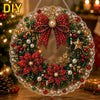 A decorative Christmas wreath made of red and green glitter, beads, and lace, with a pearl diamond painting kit visible.