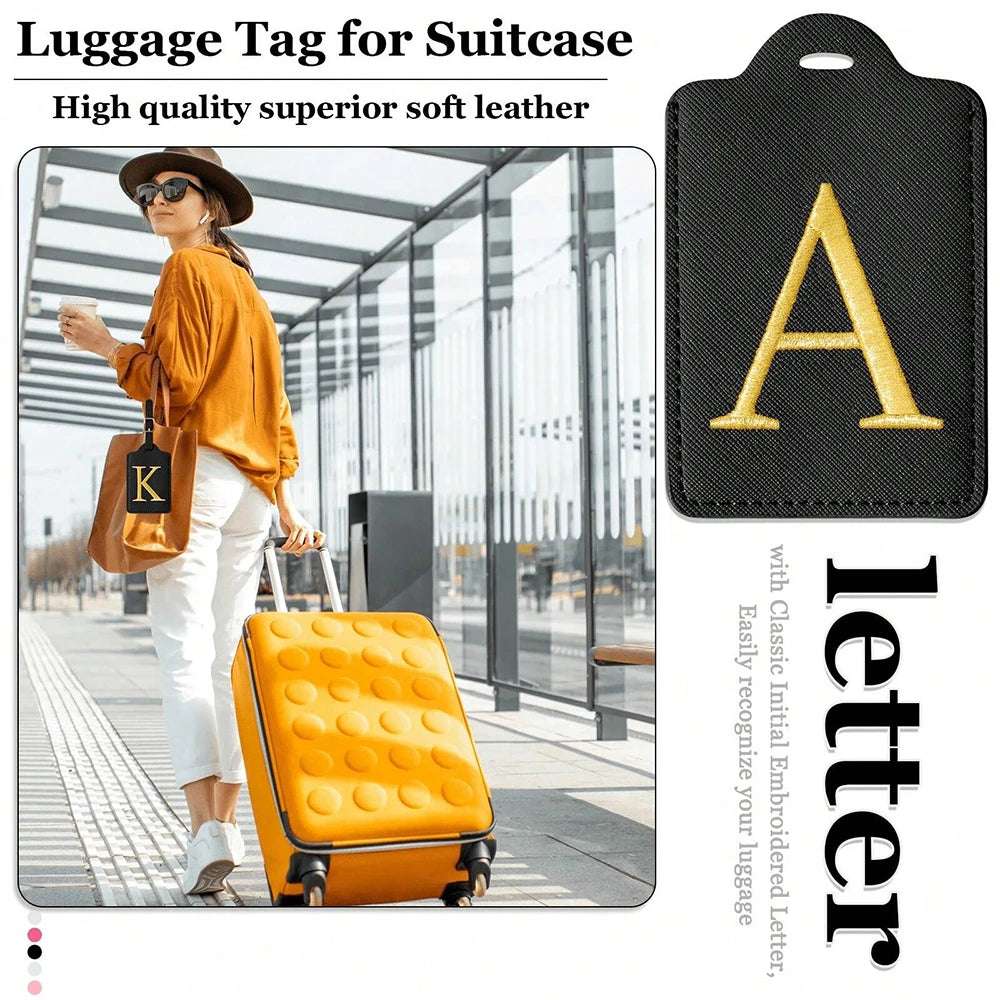 Black luggage tag with gold letter A embossed on a black fabric for suitcase identification