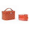 Bolsa de almacenamiento cosmético naranja con un patrón de pequeños puntos rosas.