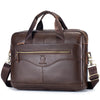 A dark brown full-grain leather executive laptop briefcase with brass hardware and padded straps.