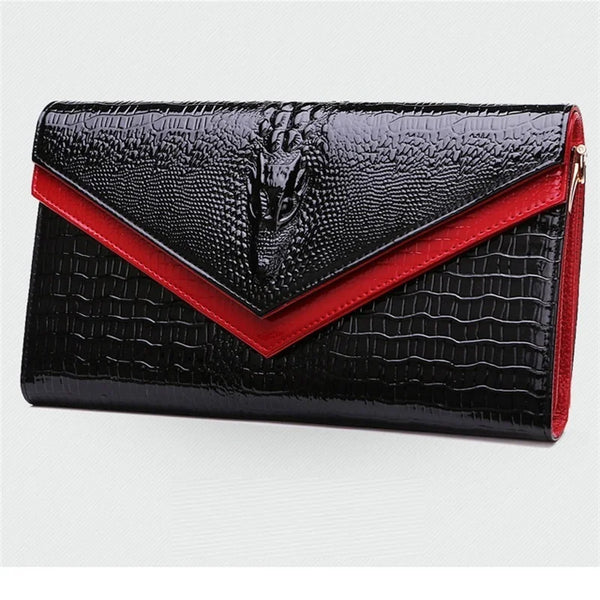 Black alligator pattern leather clutch bag with a red accent detail.