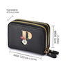 Black floral letter print mini wallet with a gold zipper detail shown from the side.