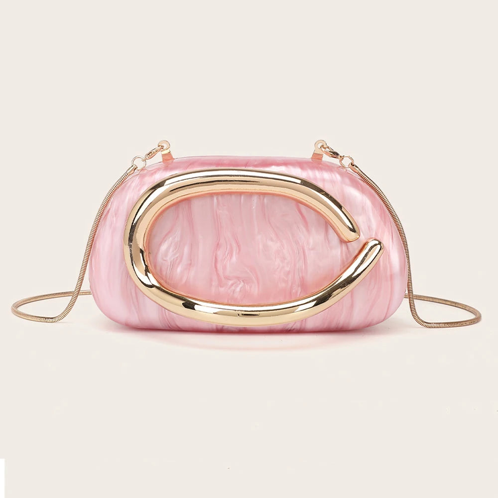 A pink marbled clutch bag with gold-tone hardware.