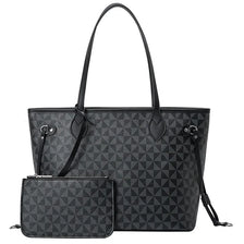 Sac en toile noir à motif géométrique de losanges et de quincaillerie dorée.