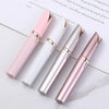 Three precision electric eyebrow trimmers in pink, white, and silver are displayed on a white background.