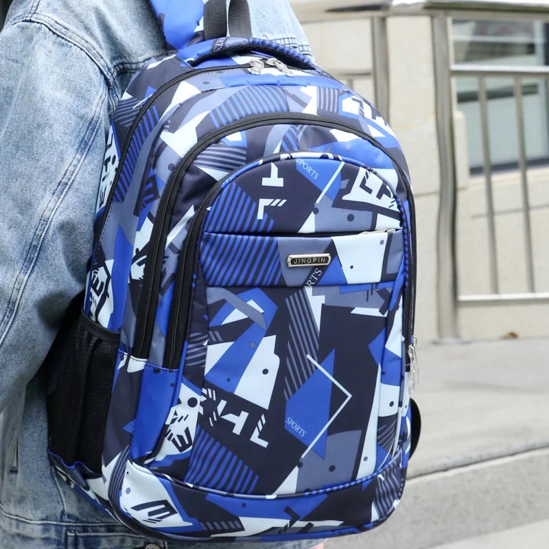 A blue and white patterned backpack worn on a person's back, featuring a laptop compartment.