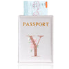 A pink leather passport holder featuring a gold initial Y and a passport inside.