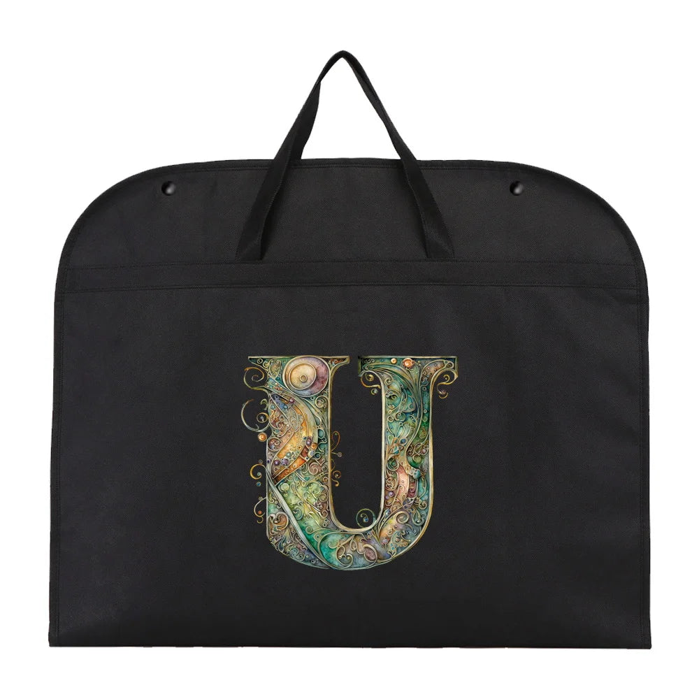 Black fabric dust cover and storage bag with a decorative letter U embroidered on it.