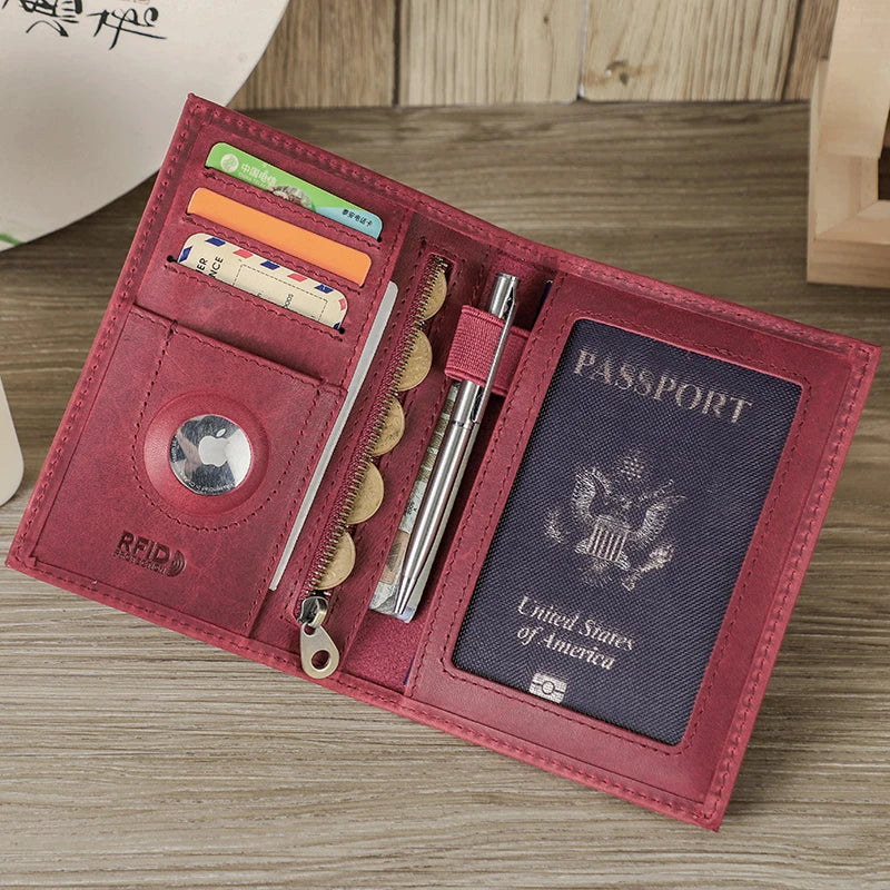A maroon leather passport card holder displaying various documents and a passport inside.