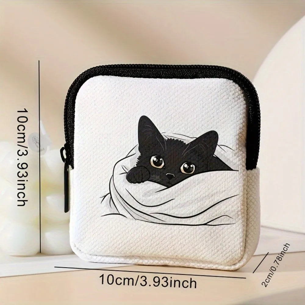 A white fabric coin purse or multi-use earphone case featuring a black cat illustration.