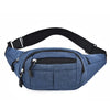A dark blue canvas waist fanny bag with black trim and zippered compartment.