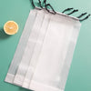 A white heavy-duty windproof automatic umbrella is displayed against a teal background with a slice of lemon nearby.