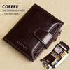 A dark brown oil-waxed leather two-fold style wallet resting on a beige surface with loose cards and coins.
