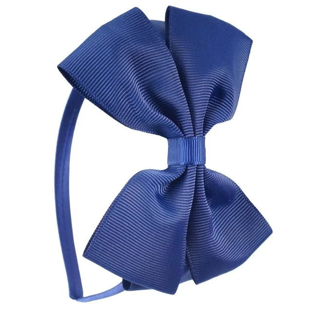 A set of solid blue satin bow hairbands for girls