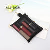 A black mesh cosmetic storage pouch containing several nail polish bottles and a small flower.