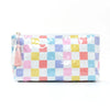 A rectangular cosmetic storage pouch featuring a colorful checkered pattern in pink, yellow, blue, and white squares.