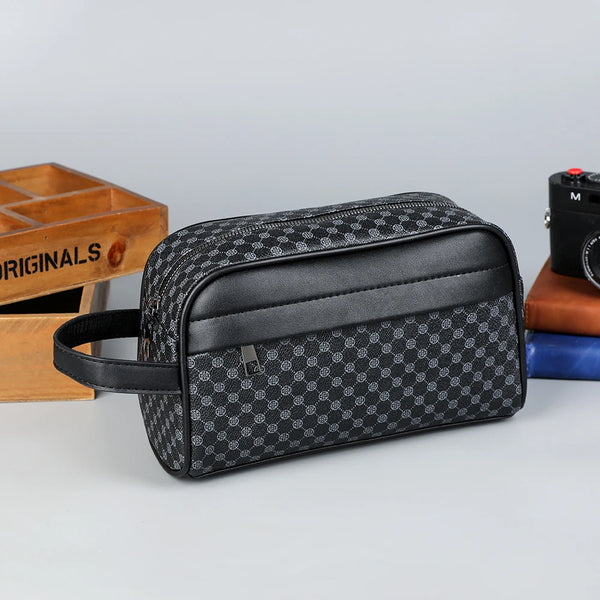 Black PU leather clutch handbag with a checkered pattern resting on a gray surface.
