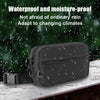 A dark gray tactical concealed carry fanny pack is shown against a background of rain.